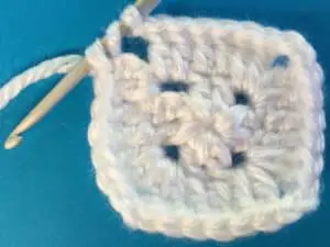 Crochet solid granny square ending row two